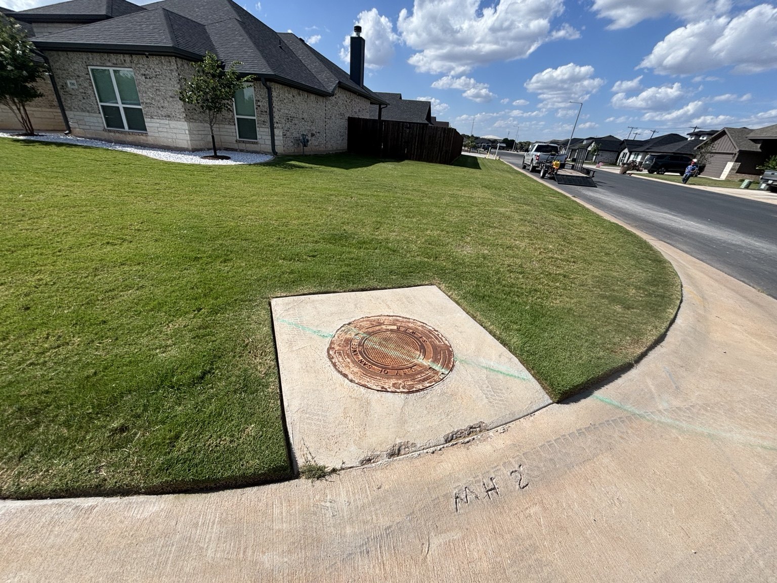 Freshly maintained corner lot lawn